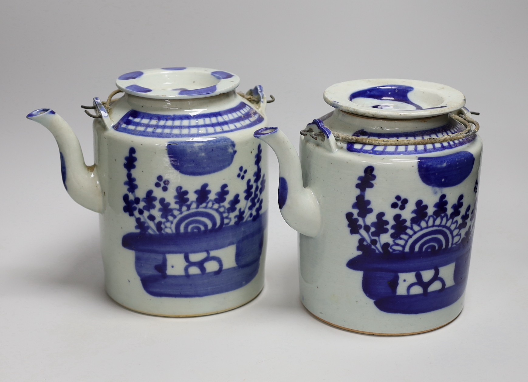 Two large Chinese blue and white teapots and covers, early 20th century, 19.5cm tall